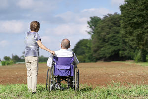 Elderly couple looking at the field