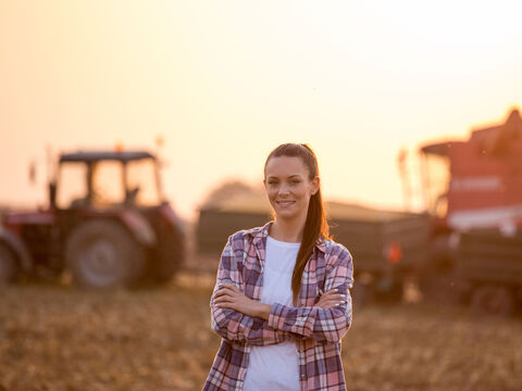 Portrait of farmer woman in field during harvest