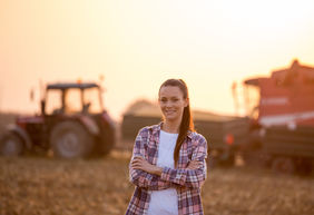 Portrait of farmer woman in field during harvest